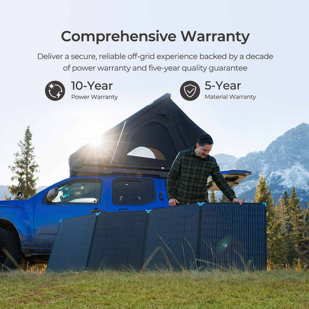 Person setting up solar panels next to a blue truck with mountains in the background, emphasizing a comprehensive warranty.